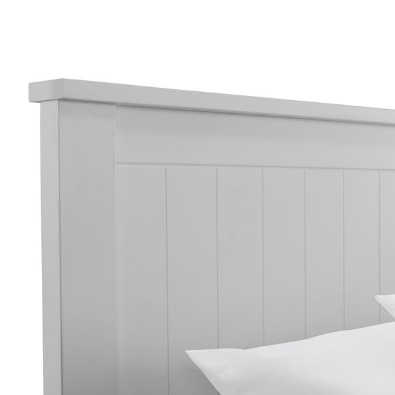Gray wooden headboard with a white bed in the foreground on a white background