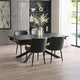 Dining room with a black dining table and chairs in a modern interior setting.