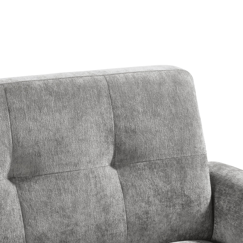 Gray upholstered chair with tufted backrest on a white background