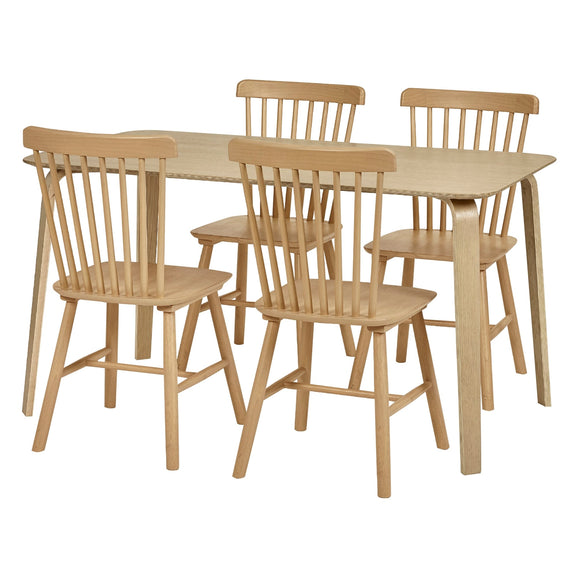 Wooden dining table with four matching chairs on a white background
