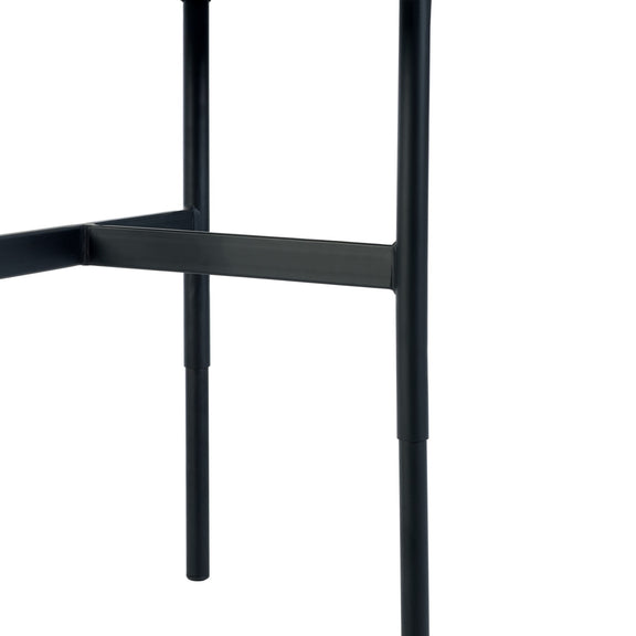 Close-up of a black metal chair frame on a white background