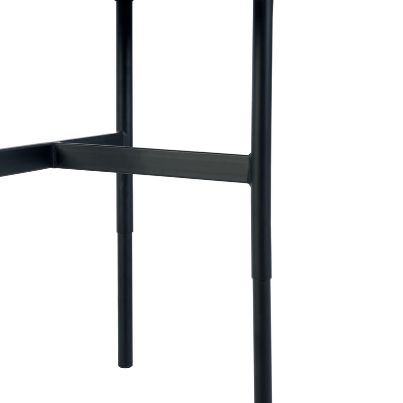 Close-up of a black metal chair frame on a white background