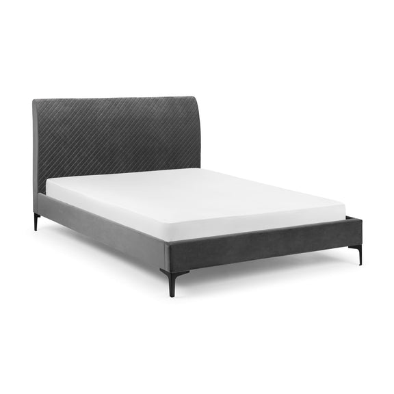 Gray upholstered bed with white mattress on a white background