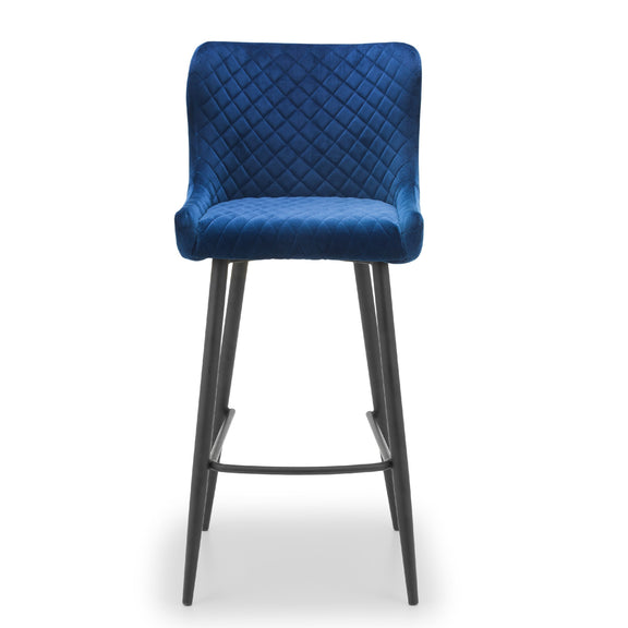 Blue quilted bar stool with black legs on a white background