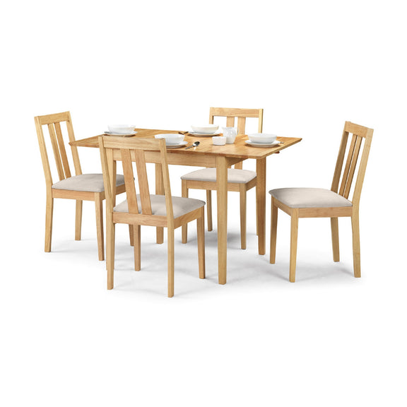 Wooden dining table set with four chairs on a white background