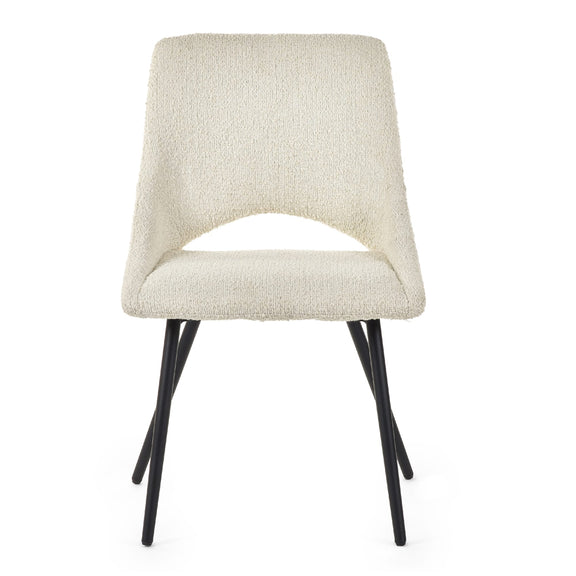 Beige upholstered chair with black legs on a white background