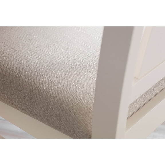Close-up of a textured beige ceiling with a white frame.