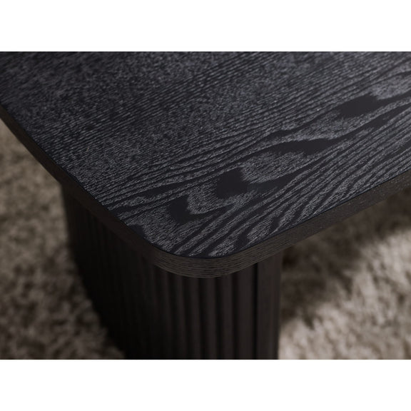 Close-up of a textured black surface on a carpeted floor