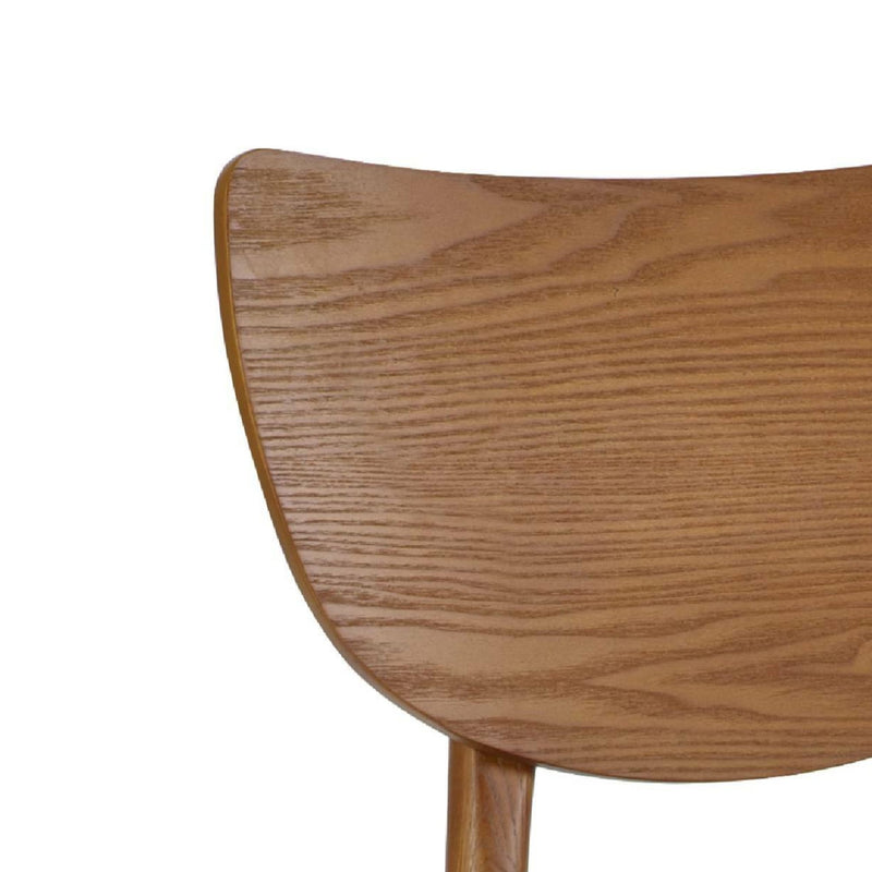 Close-up of a wooden chair backrest on a white background