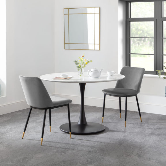 Dining table with two chairs in a modern room