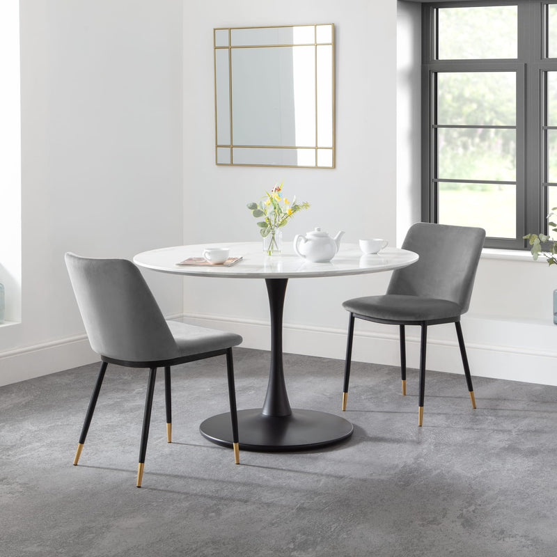 Dining table with two chairs in a modern room