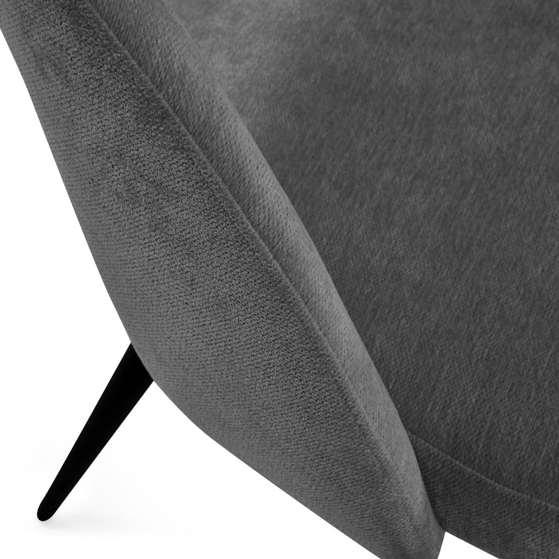 Gray upholstered chair with a black metal leg on a white background