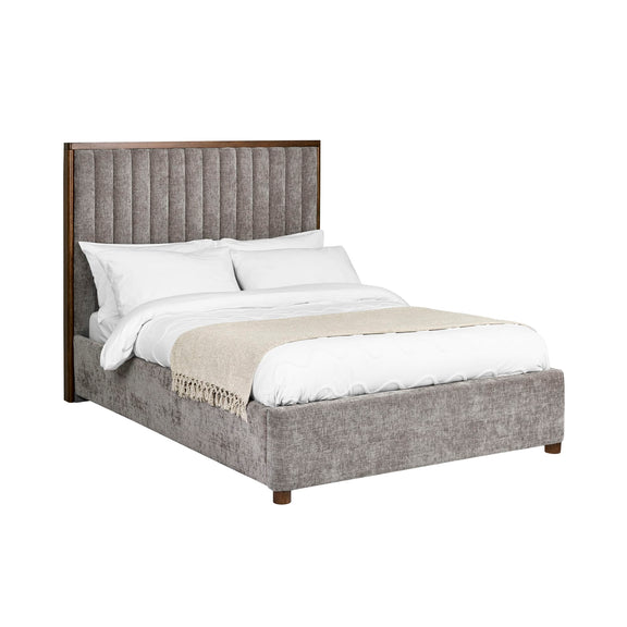 Gray upholstered bed with white bedding on a white background