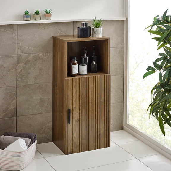 Wooden cabinet with shelves against a tiled wall in a bathroom setting.