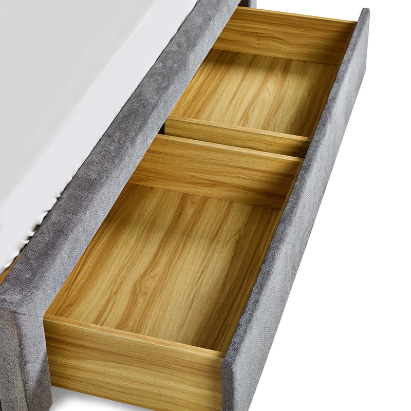 Wooden drawer with gray interior liner on a white background