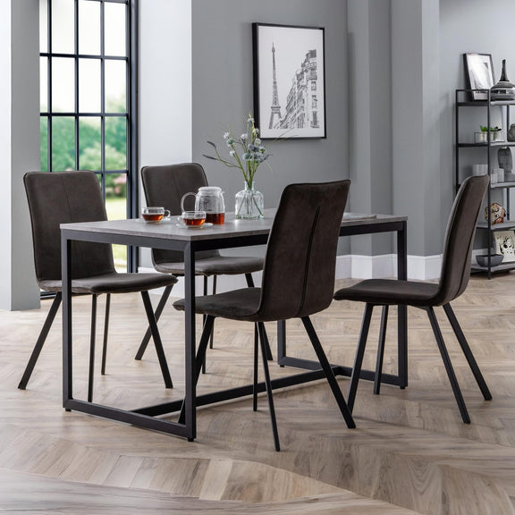 Dining room with a table and chairs in a modern interior setting.