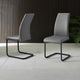 Two gray chairs with quilted design on a tiled floor.