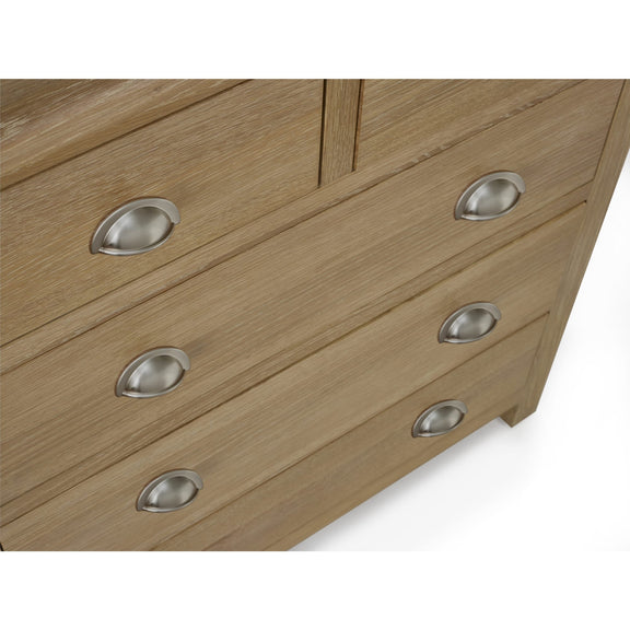 Wooden dresser with silver handles on a white background
