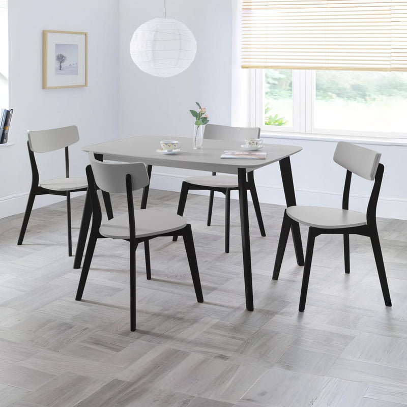 Dining room with a table and chairs in a modern interior setting.