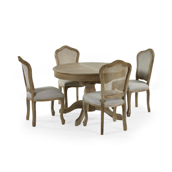 Round wooden dining table with four matching chairs on a white background