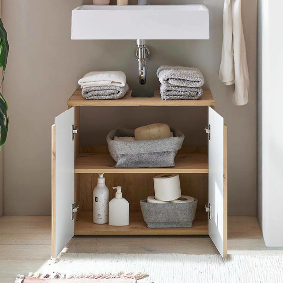 Bathroom cabinet with towels and toiletries on a neutral background