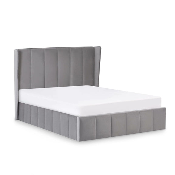 Gray upholstered bed frame with white mattress on a light gray background