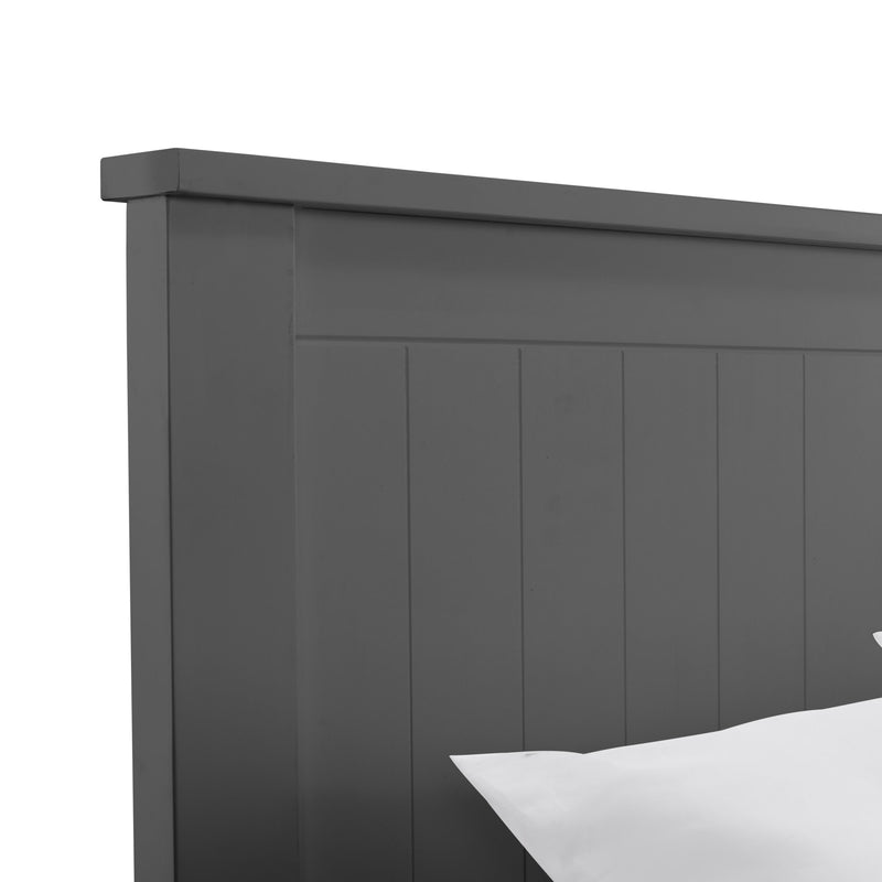 Dark gray wooden headboard with a white pillow on a white background