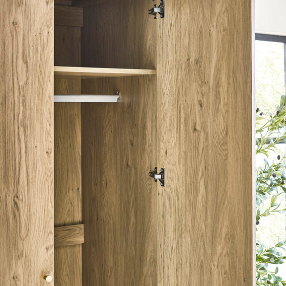 Wooden wardrobe with open doors showing shelves and hinges.