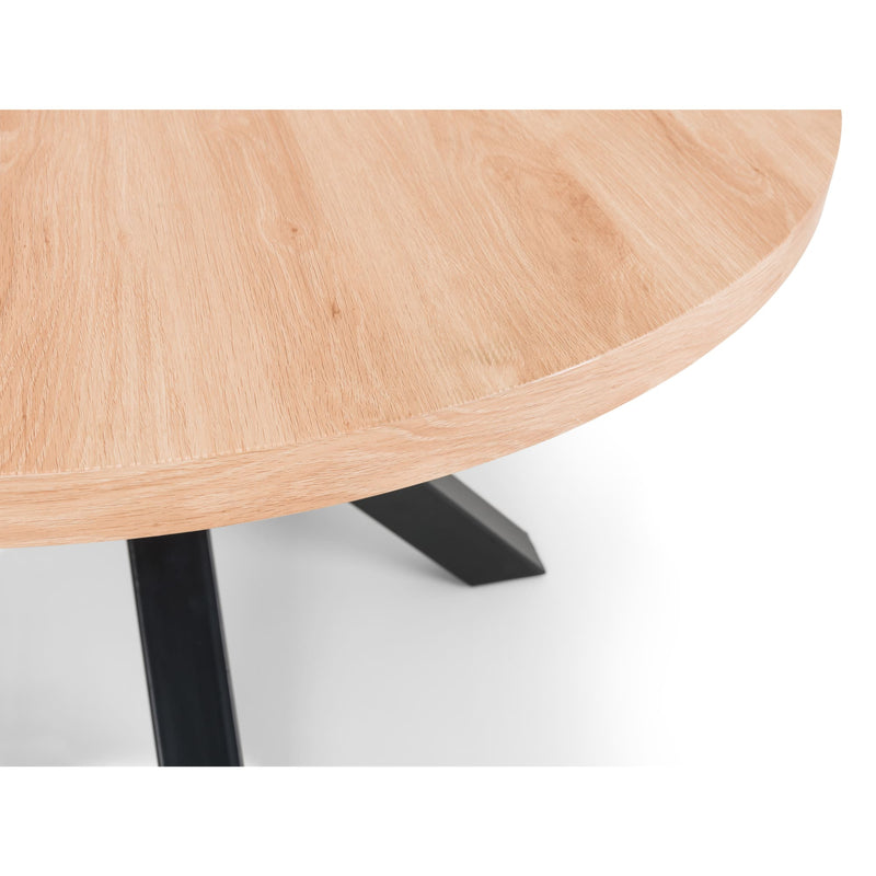 Round wooden table with black legs on a white background