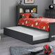 Children's bedroom with a gray bed frame, red bedding, and sports balls on the floor.