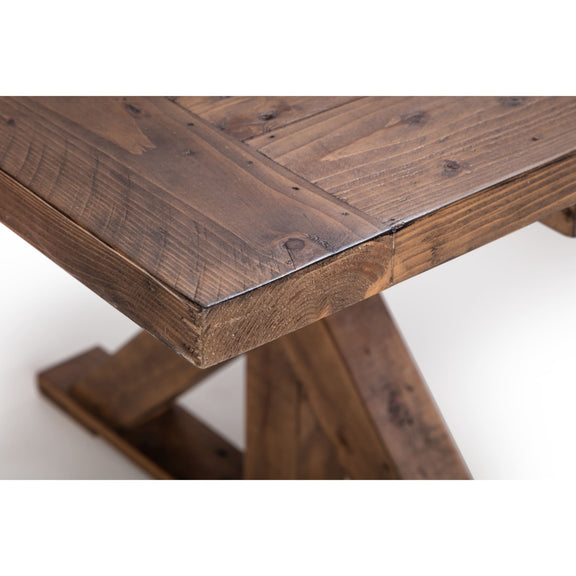 Close-up of a wooden table with a rustic design on a white background