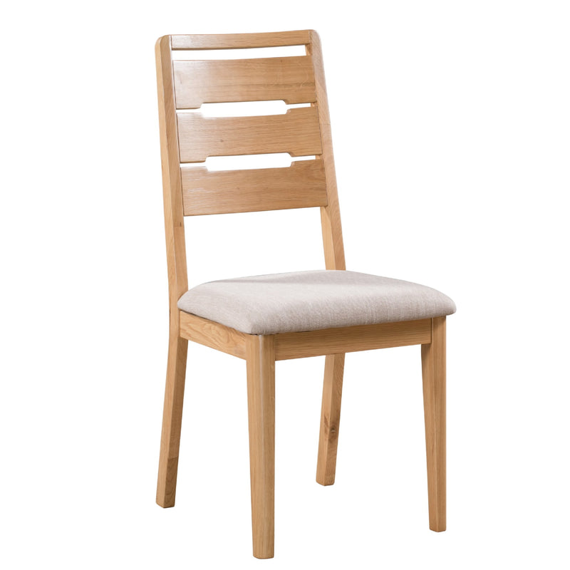 Wooden chair with a beige cushion on a white background