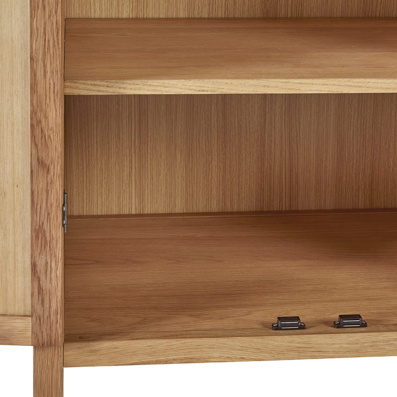 Wooden cabinet with open door showing interior shelves.