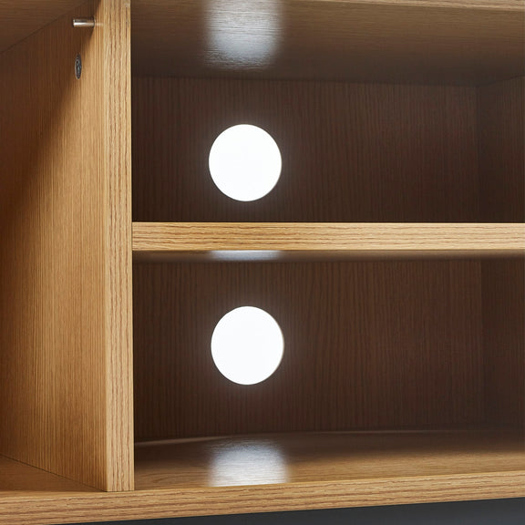 Wooden shelf with embedded lights on a dark background