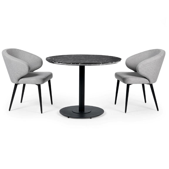 Round black marble table with two gray chairs on a white background