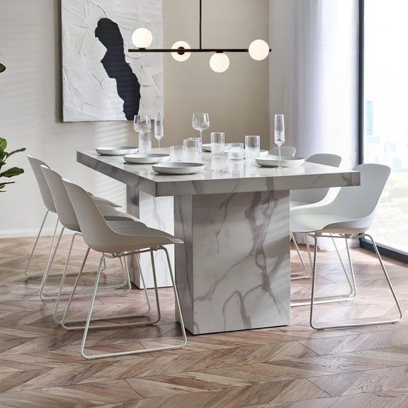Modern dining room with marble table and chairs