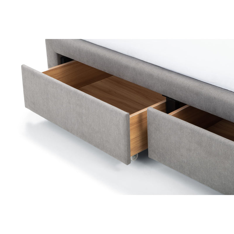 Gray upholstered bed with open wooden drawers on a white background