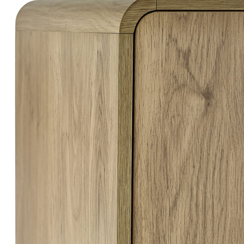 Close-up of a wooden cabinet with a light wood finish