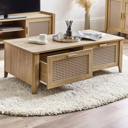 Wooden coffee table with rattan accents in a living room setting