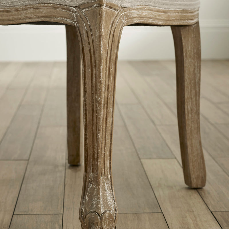 Close-up of a wooden chair leg on a wooden floor