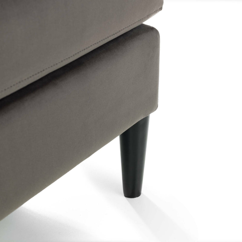 Gray upholstered chair with a black leg on a white background